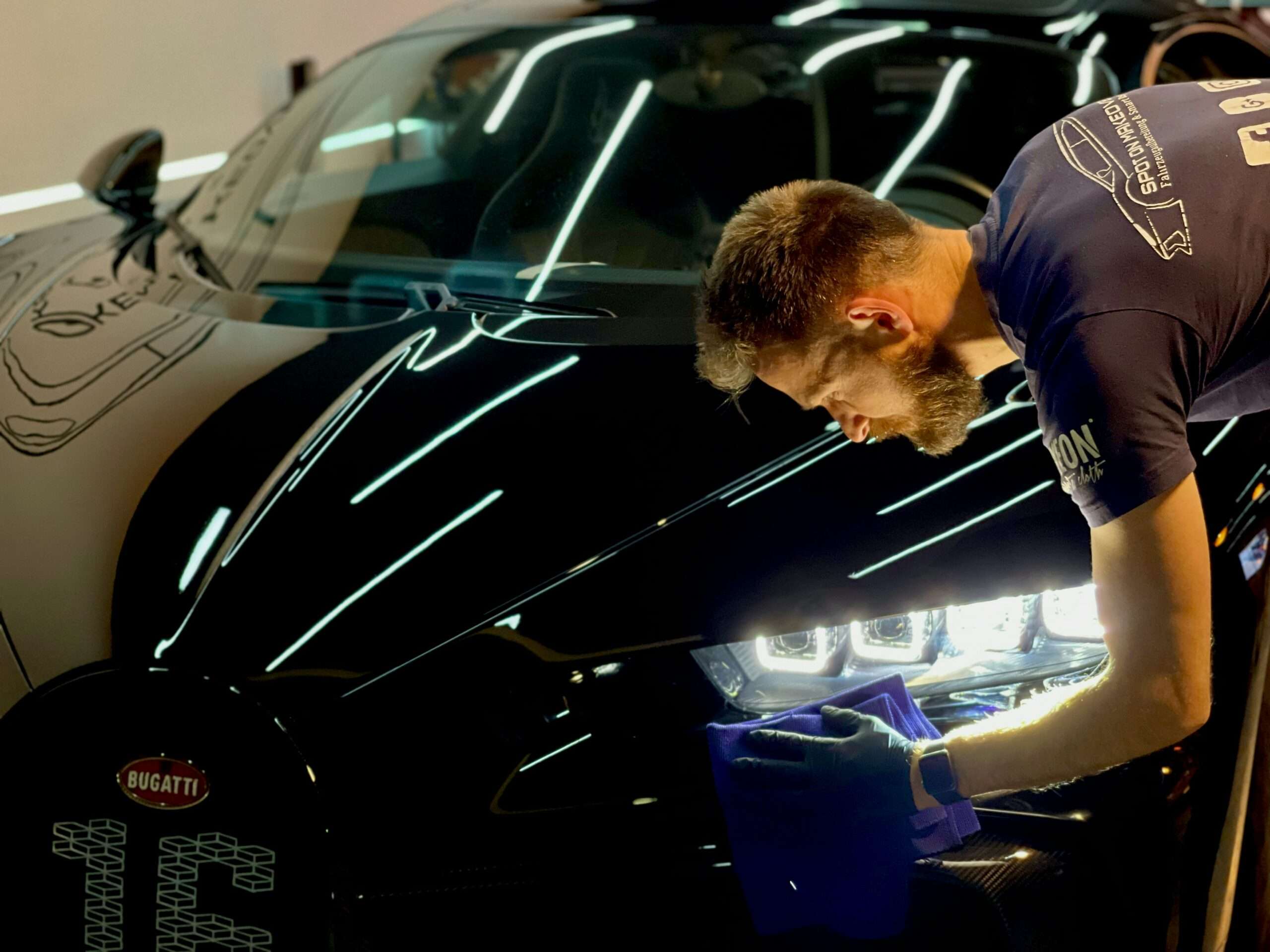 Man detailing a car