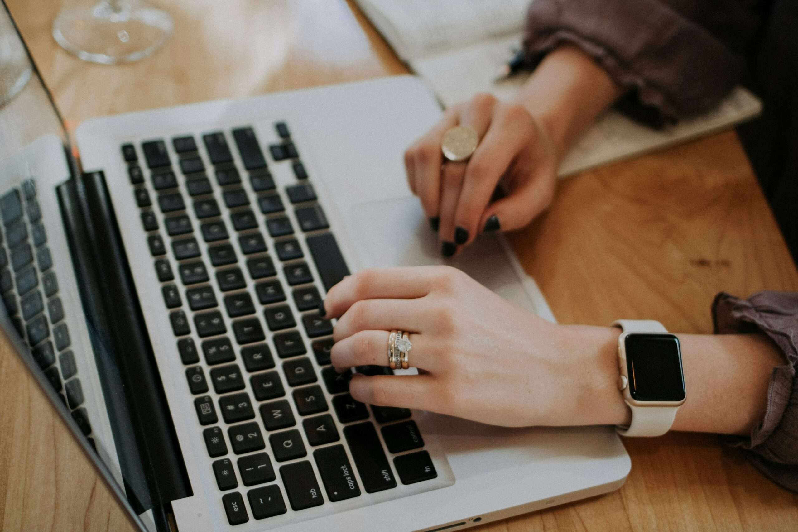 Woman typing on a computer